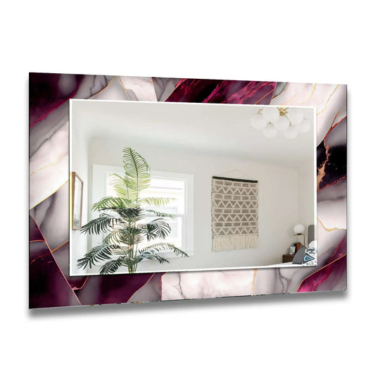Dark pink and white marble lighted bathroom mirror with gold accents reflects a room and creates a modern luxury decor statement