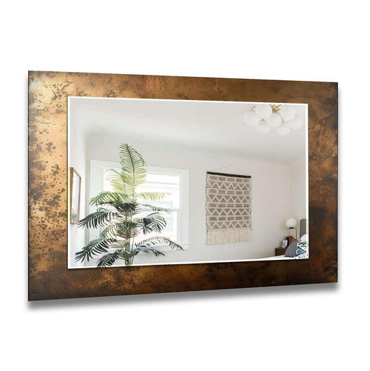 A decorative wall mirror with a bronze abstract textured frame horizontal featuring an industrial wall decor style and elegant design