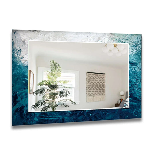 Decorative wall mirror with a blue sea waves design showing foamy white and deep blue a vibrant coastal inspired abstract mirror