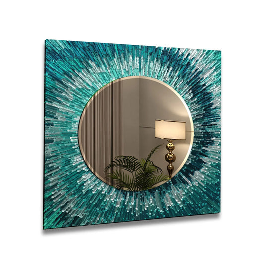 A turquoise splash wall mirror with an abstract teal and blue radiating design on tempered glass