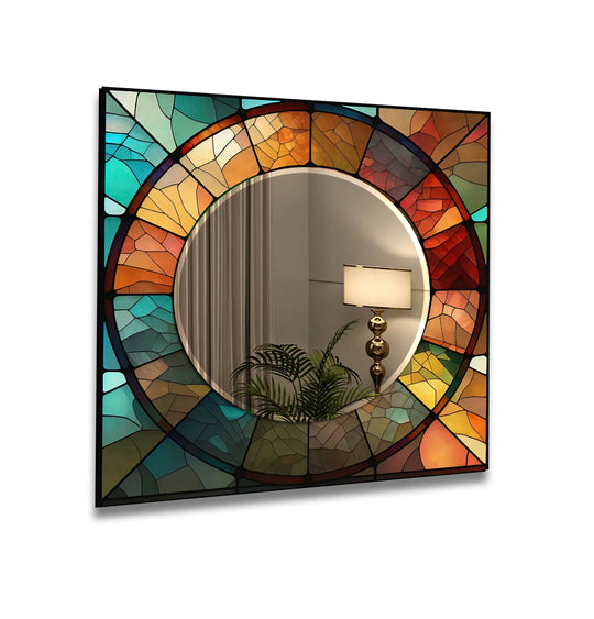 The circle wall mirror has orange and teal stained glass and a black frame and is artistic mirror art to add warmth and elegance to any space
