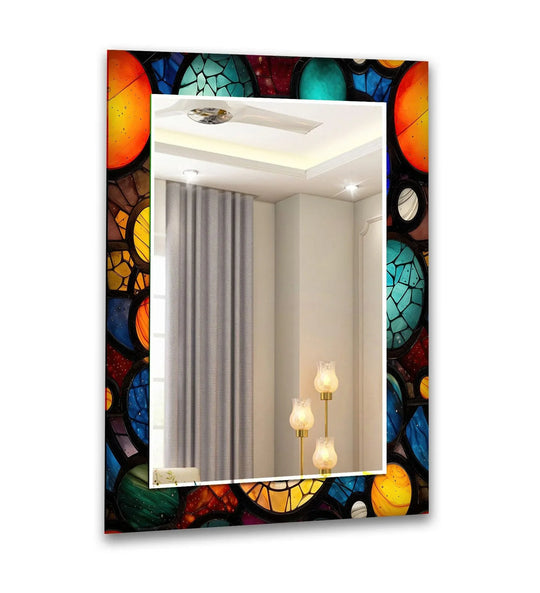 A vertical orange blue and yellow rounds wall mirror featuring a stained glass artistic abstract border reflecting a room