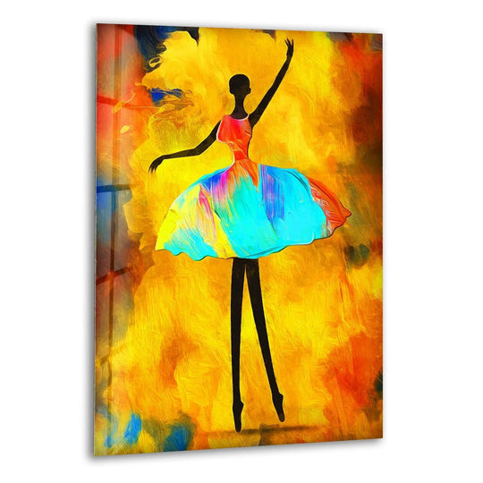 A silhouette of a ballerina with a vibrantly painted tutu stands out against abstract yellow and orange glass wall art decor.