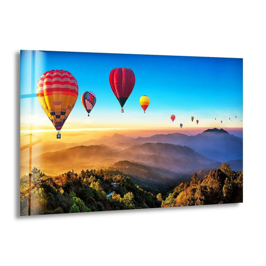 Landscape glass wall art shows a balloon ride with sunset sky and mountain vista plus enchanting sunset decor