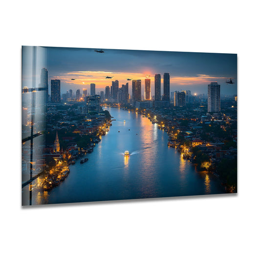 High color contrast showcases the stunning Bangkok cityscape in this tempered glass wall art print, with golden light reflecting off the river amidst the dark buildings and sky.