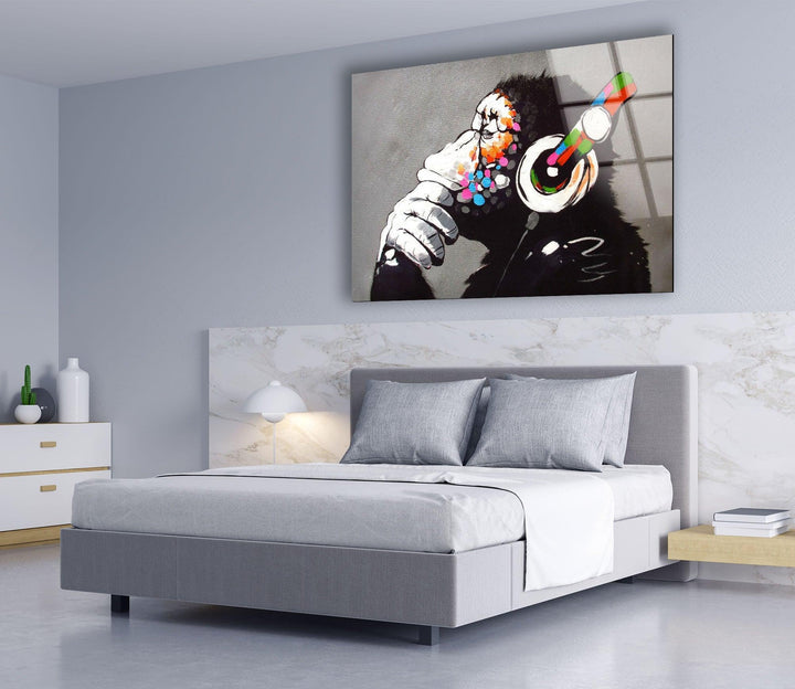 a bedroom with a bed and a painting on the wall