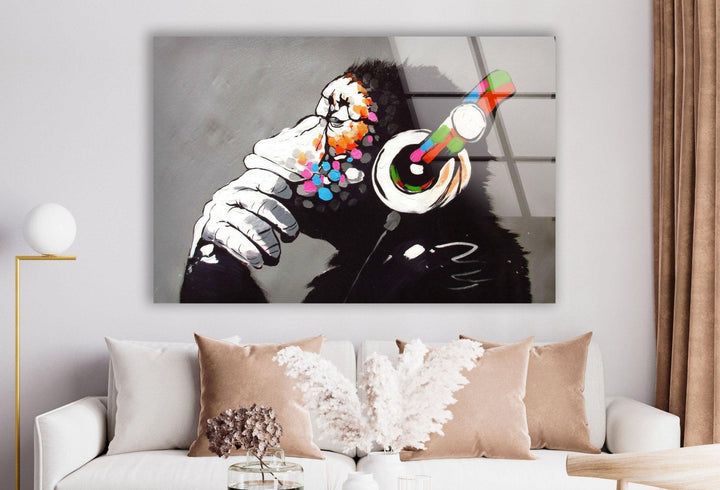 a living room with a couch and a painting on the wall