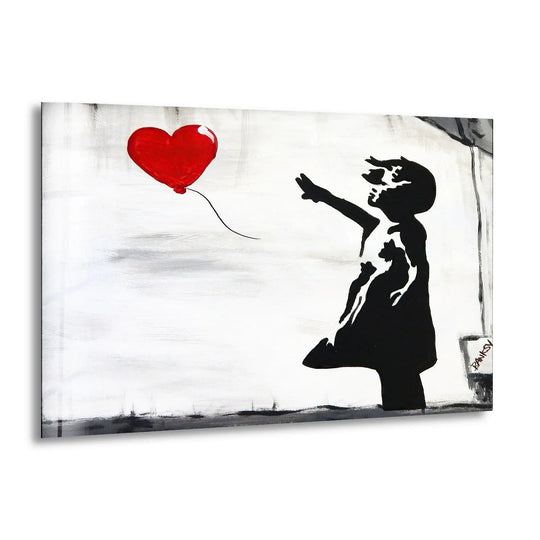Banksy Girl with Balloon glass wall art shows a black silhouette and red heart a piece of urban style Banksy wall art and unique art print