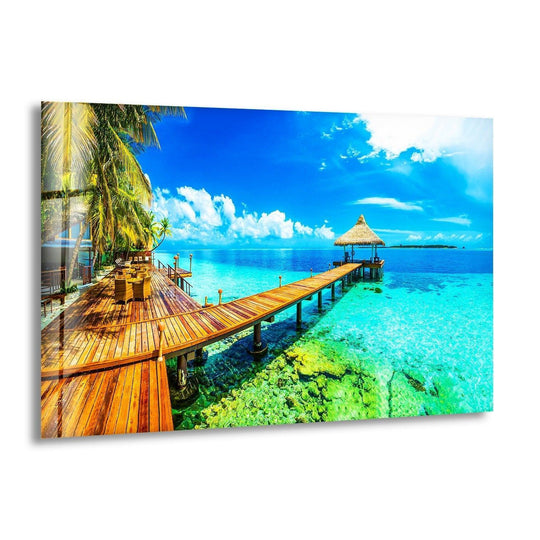 Sunlight blazing off the clear sky and tranquil azure water creates the brightest area in this beautiful paradise island glass wall art, showcasing the best glass art.