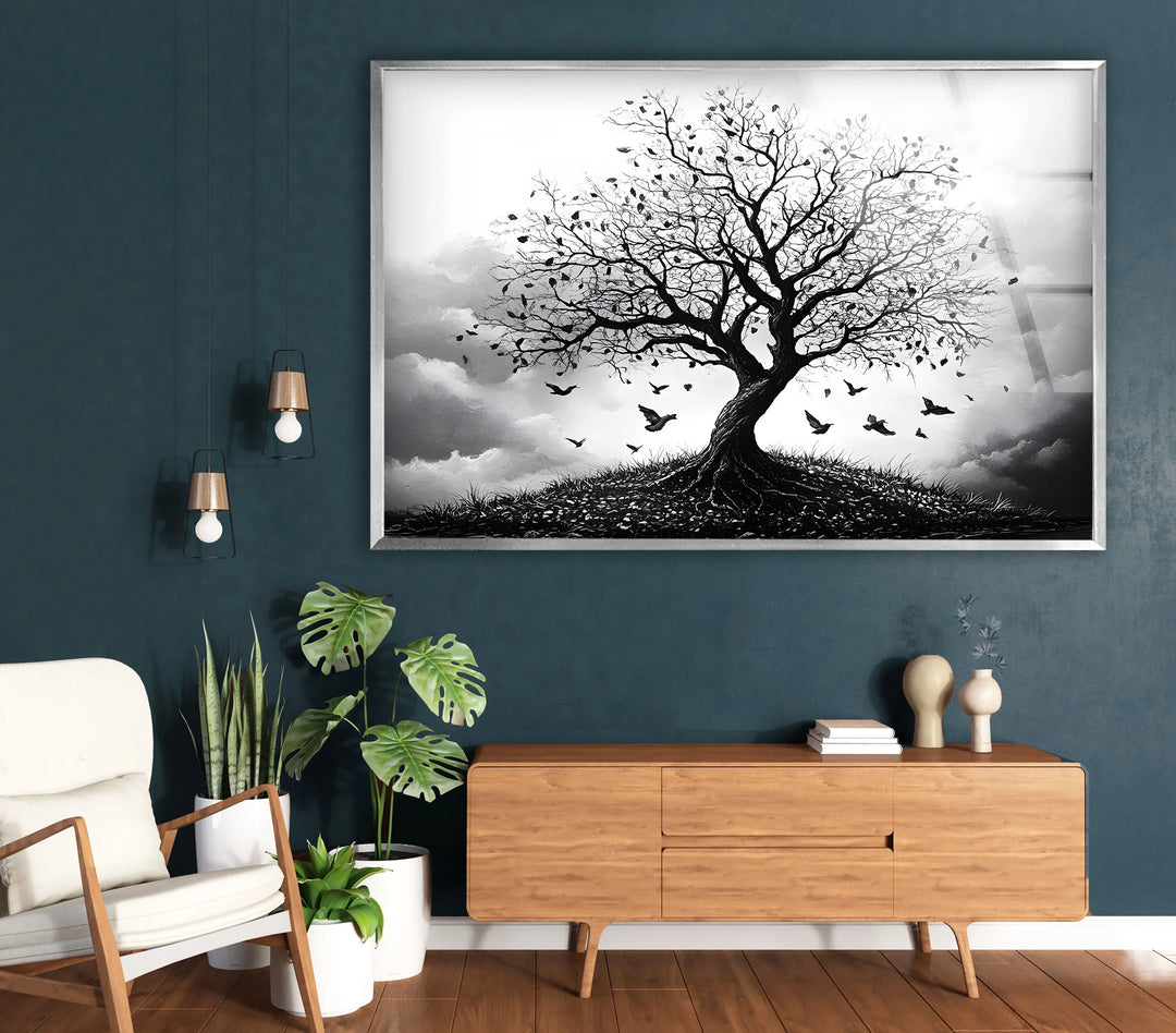 Black and white nature artwork on tempered glass highlighting a lone tree and a flock of birds.