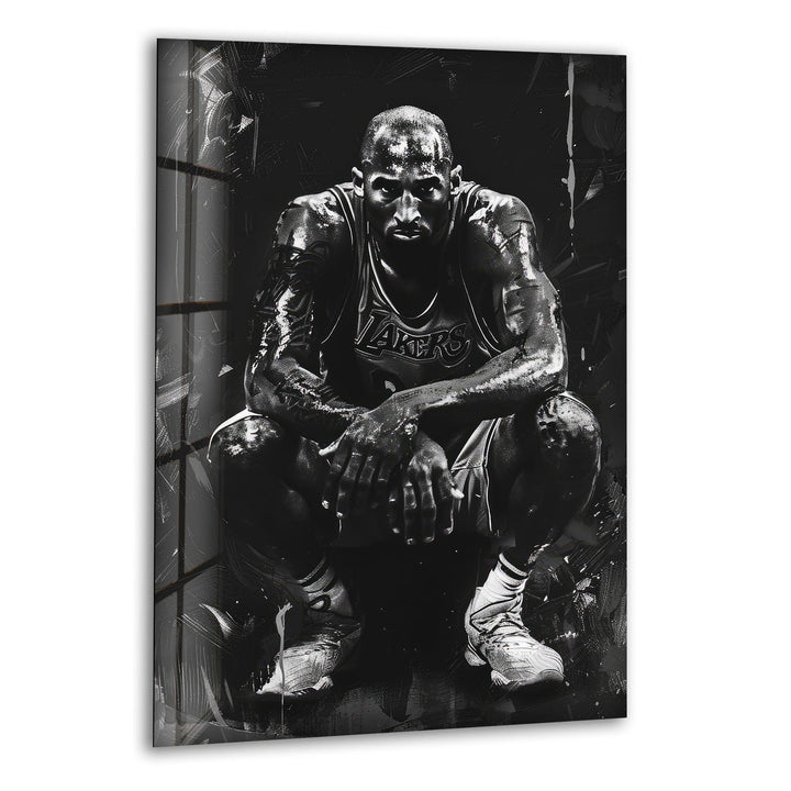 Black and white glass wall art featuring a powerful basketball player crouching in a dramatic textured style.