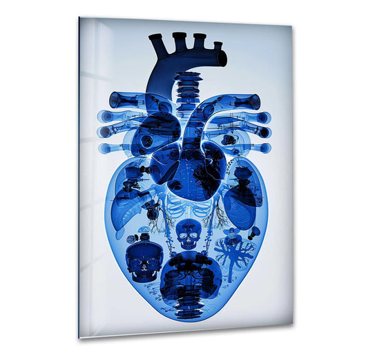 An electrifying blue mechanical heart made of glass wall art features intricate anatomical and mechanical details in its loudest element.