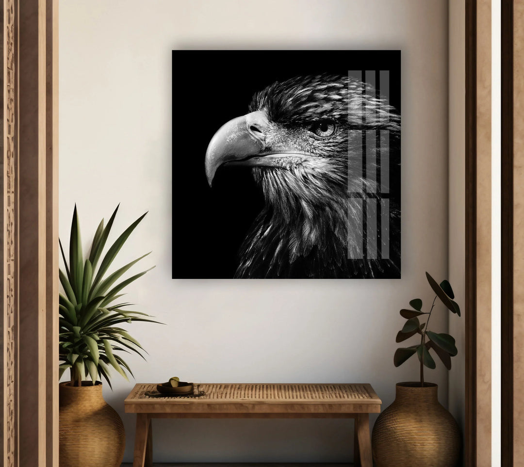High-contrast eagle portrait with sharp beak and textured plumage on glass décor.