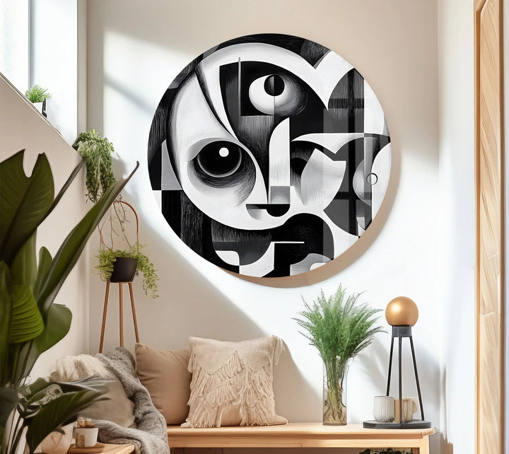 Grayscale cubist illustration on tempered glass with overlapping forms and bold facial outlines.