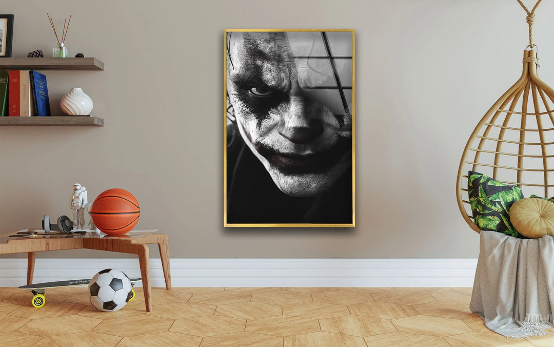 Moody monochrome artwork of a chilling clown face under dramatic lighting.