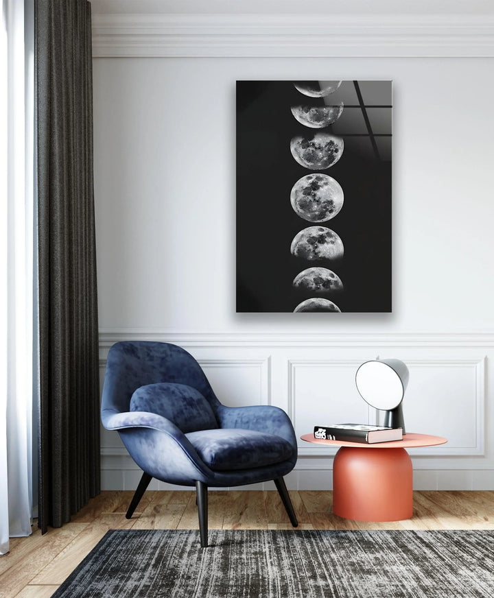 Monochrome glass art featuring a series of lunar phases arranged in a clean vertical line.