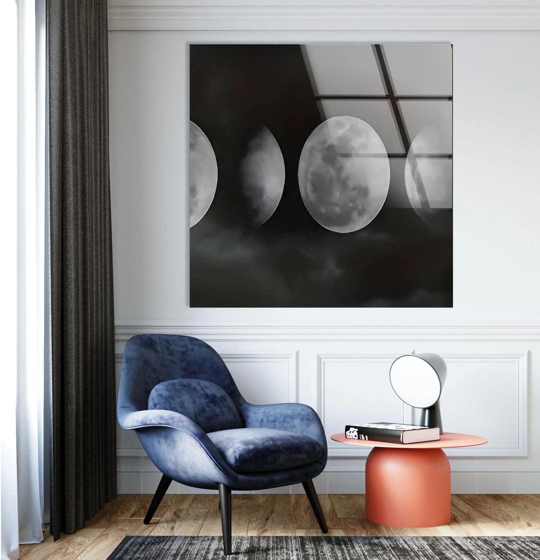Black and white atmospheric lunar cycle artwork with textured clouds surrounding each moon.