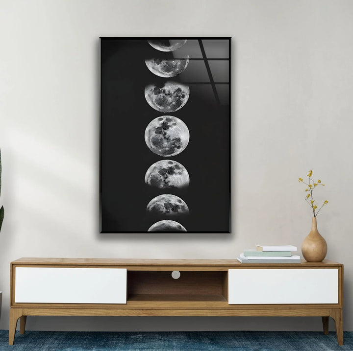 Vertical glass print showing sequential moon phases in a minimalist black and white style.