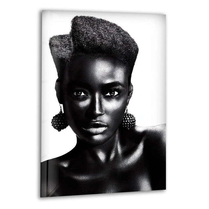 Stylish black and white glass wall art featuring a strong portrait of a woman with textured hair and bold earrings.