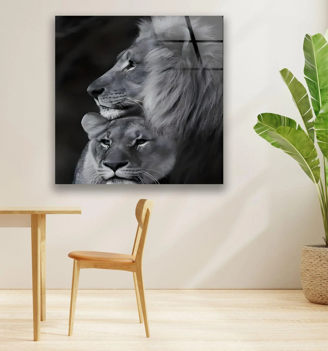 Grayscale wildlife artwork showing a lion and lioness leaning together in harmony.
