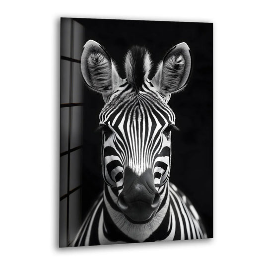 Black and white glass wall art featuring a close-up zebra portrait with detailed stripes and sharp contrast.