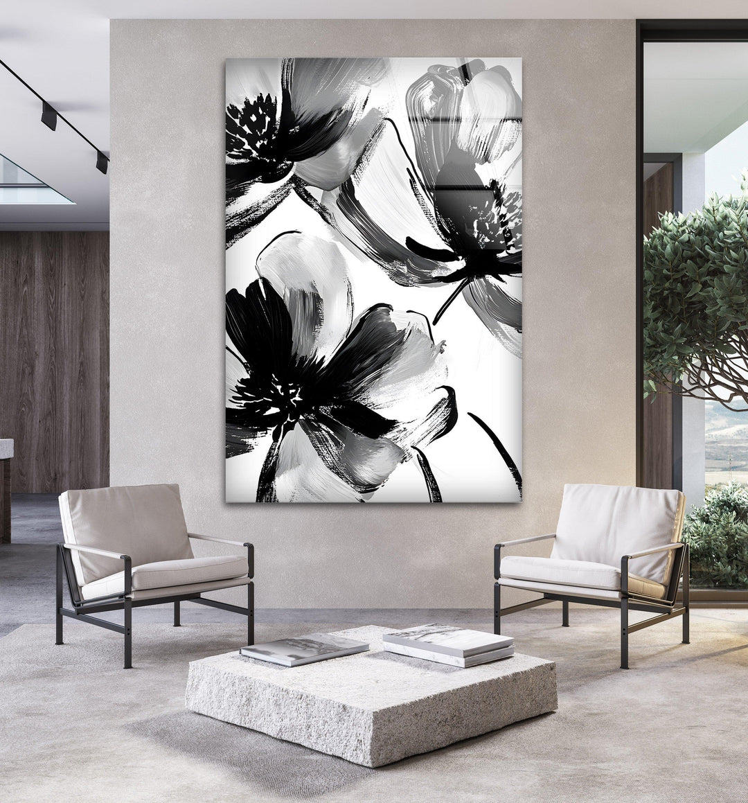 Bold black and white floral brushstroke design printed on stunning glass wall art.
