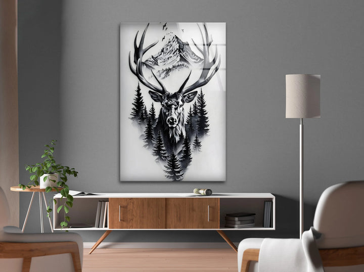Bold monochrome deer artwork on glass combining forest silhouettes and alpine scenery.