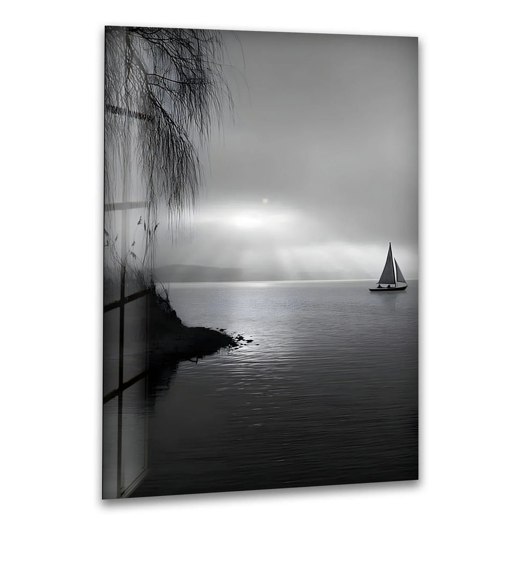 Black and white glass wall art of a sailboat drifting on calm water under soft sun rays.