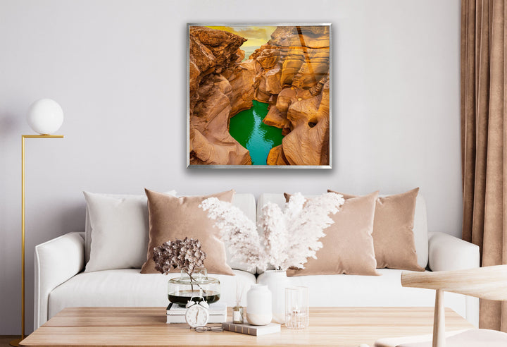 Panoramic canyon scene with dramatic lighting and a peaceful river flow, printed on glass.
