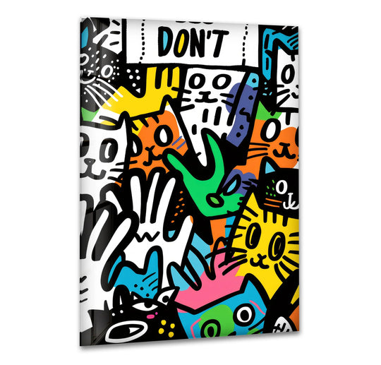 A vibrant, layered glass wall art print features a collage of colorful, graffiti-style cats in the style of Keith Haring.