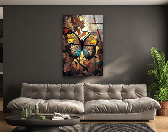 Organic forms in stained glass art depict a brown butterfly amidst earthy-toned leaves, a captivating piece of best glass art.