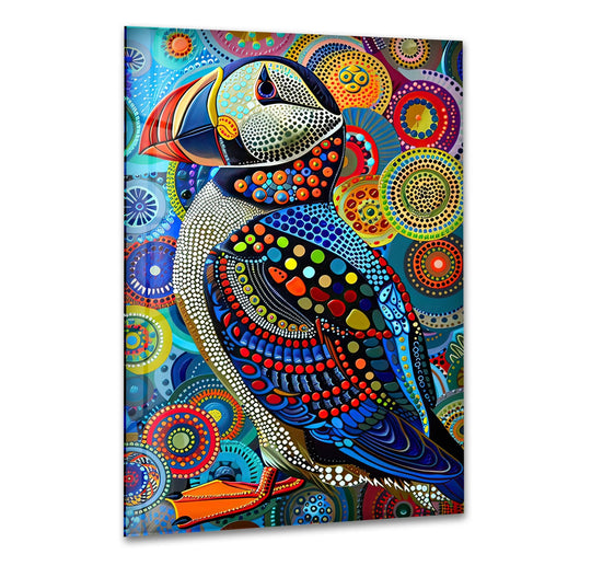 Colorful puffin glass wall art prints featuring an abstract background of vibrant, concentric circular patterns.
