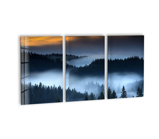 The glass wall art shows a foggy forest landscape at sunset and evokes peaceful nature inspired decor
