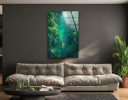 Displayed decorative wall art features an overhead perspective of a river with a boat and lush foliage.