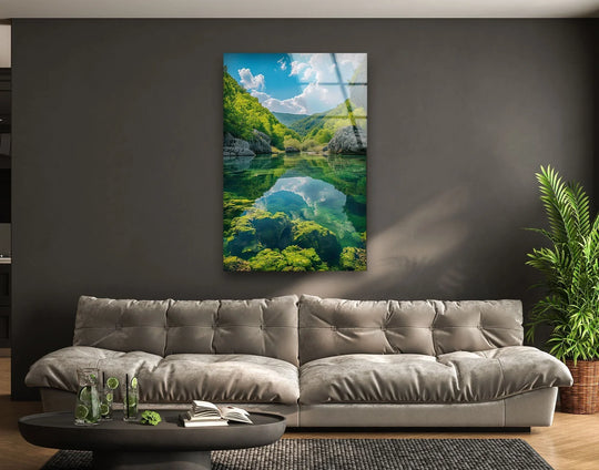 High color saturation enhances the vibrant greens and blues in this crystal clear lake print wall art, creating a breathtaking reflection of nature.
