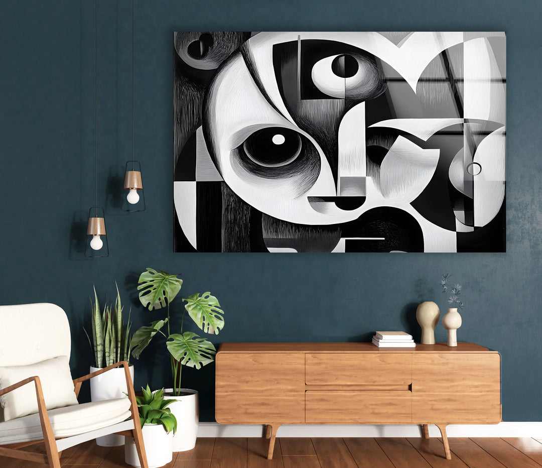 Artistic cubist panel on glass showing a stylized face composed of circles, arcs, and angular structures.