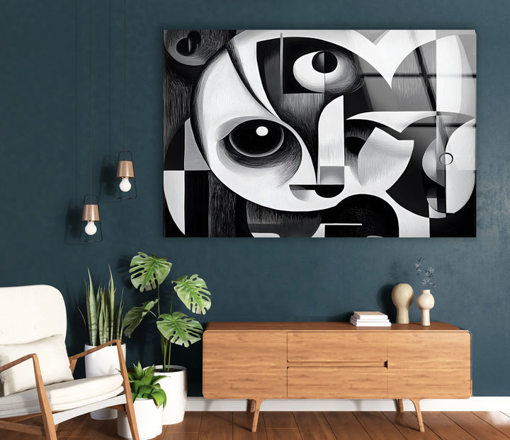 Artistic cubist panel on glass showing a stylized face composed of circles, arcs, and angular structures.