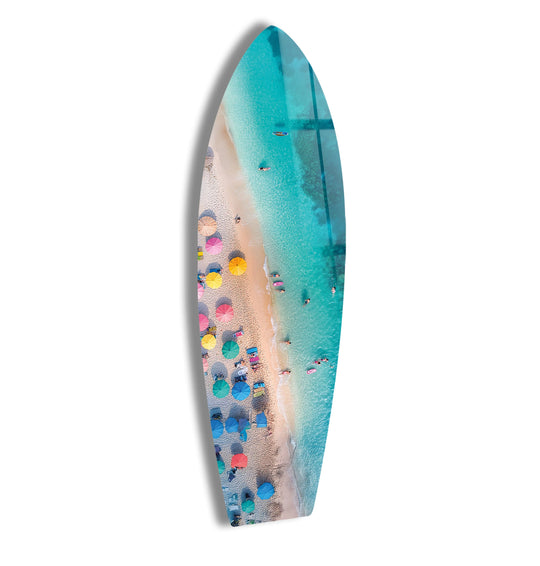 SurfBoard glass wall art tropical beach scene with colorful umbrellas and turquoise water is cool coastal home decor and coastal interiors art
