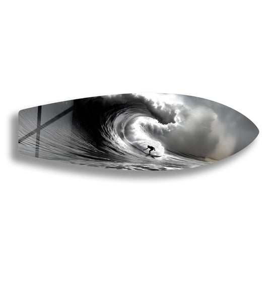 Predominantly monochrome, this print wall art features a surfer silhouetted within a powerful black and white wave, resembling a surfboard-shaped piece.