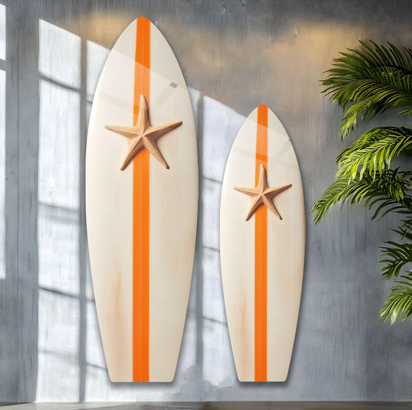 Two vertical, surfboard-shaped glass wall art pieces with orange stripes and starfish add home decoration.