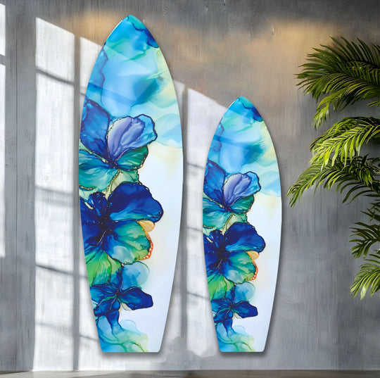 SurfBoard showcasing alcohol ink flower and blue hues is glass wall art plus floral wall art and surfboard decor for modern and coastal themes
