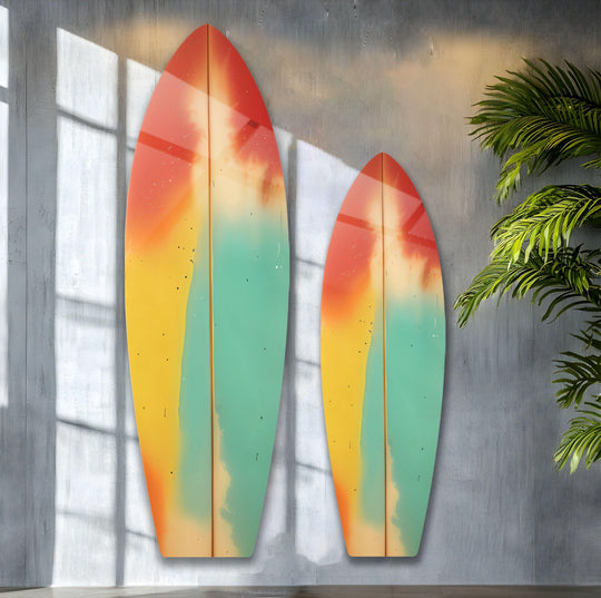 Vibrant green, red, and yellow hues dominate this abstract surfboard glass wall artwork, creating a dynamic beach scene.