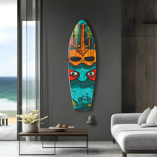 Vibrant turquoise transitions to deep blues and fiery oranges on this unique surfboard art from glass, featuring a stylized face and a cycling motif.
