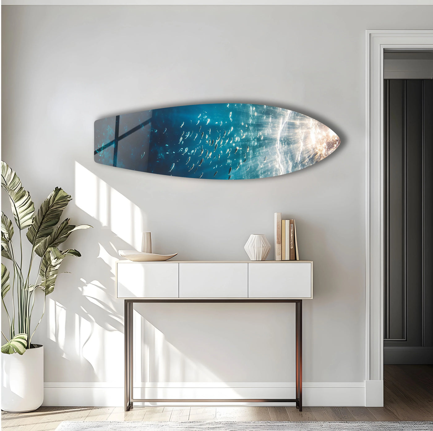 Shimmering light illuminates the ocean surface in this underwater surfboard hanging wall art, casting a warm glow over the mesmerizing scene of marine life.