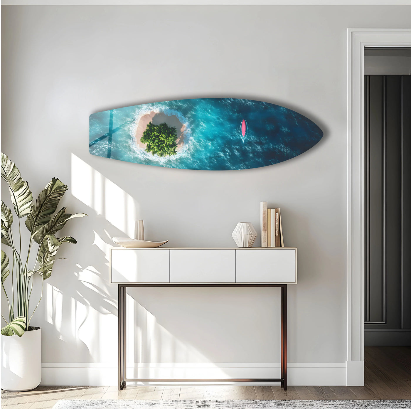 Bright, negative space surrounds the surfboard-shaped print wall art, showcasing an aerial view of a tropical island escape.