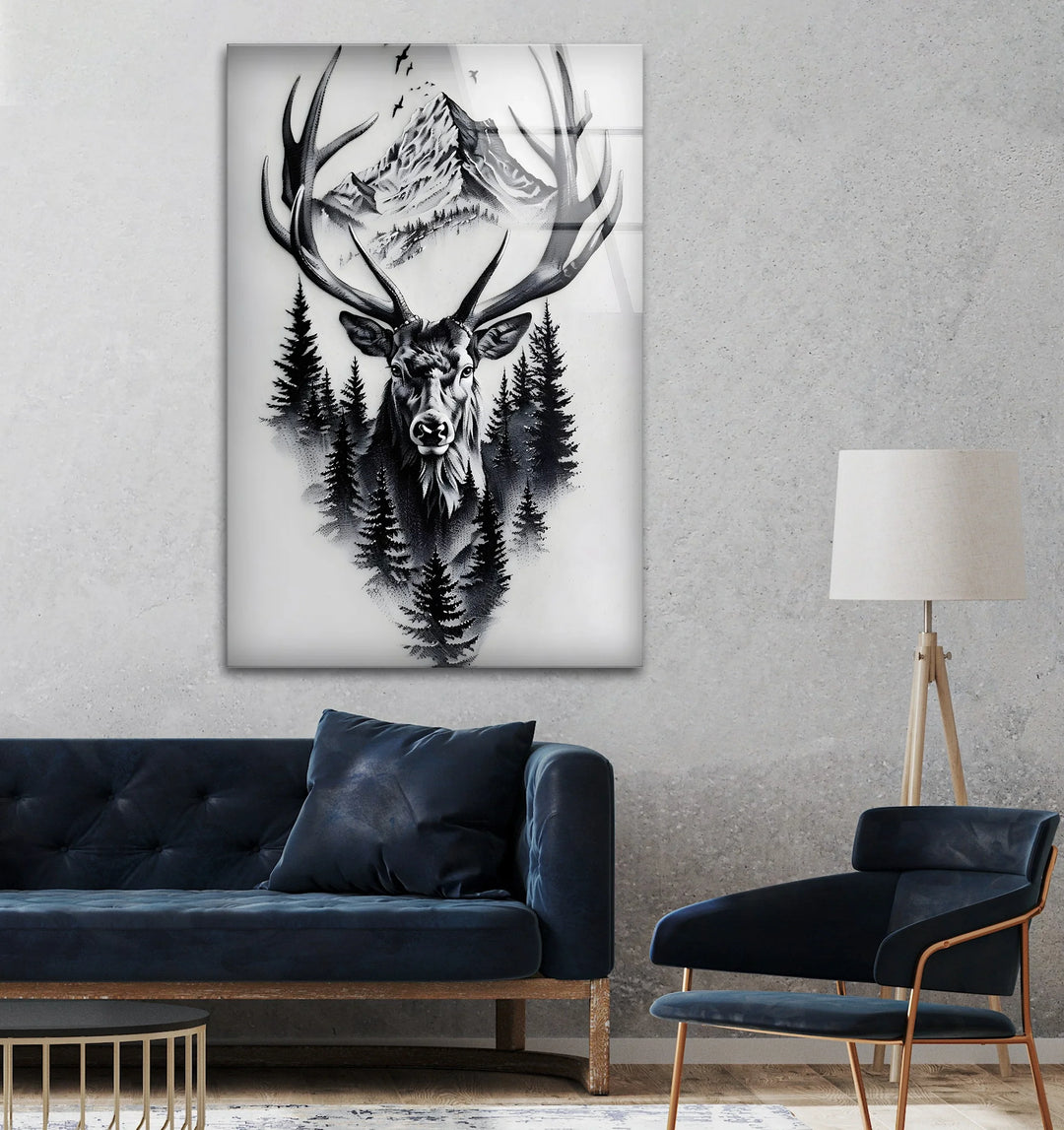 Monochrome glass art of a deer head framed by forest pines and distant mountain peaks.