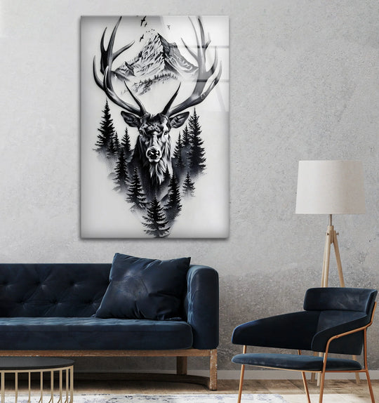 A detailed black and white stag with large antlers and forest trees emerges from a mountain scene in this glass printing artwork.