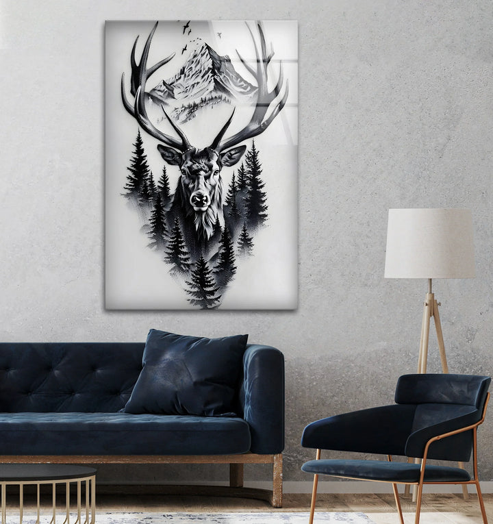 Monochrome glass art of a deer head framed by forest pines and distant mountain peaks.
