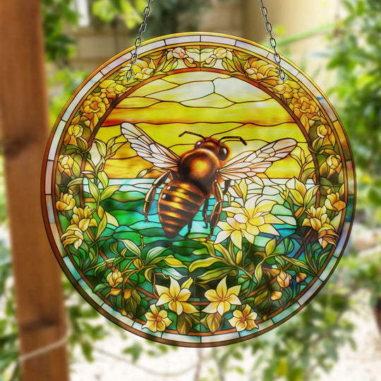 Stained with bee detail shows how art from glass creates a suncatcher decor that transforms light into stunning colors and brings a whimsical touch to any space.
