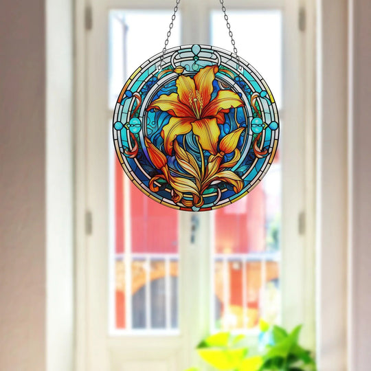 Round, vertically-oriented stained flower suncatcher creates a unique print wall art with shades of orange and blue glass.